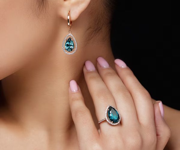 model-shows-earrings-ring-with-beautiful-blue-precious-stones_8353-5043