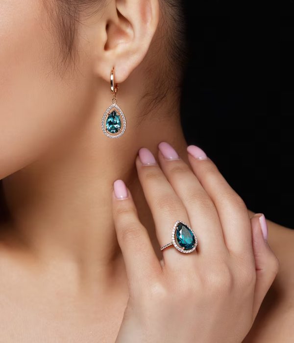 model-shows-earrings-ring-with-beautiful-blue-precious-stones_8353-5043